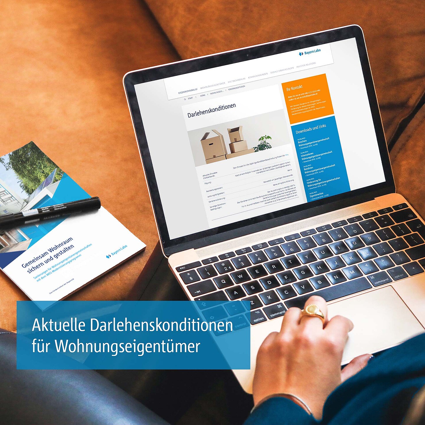 WEG-Website auf Laptop und WEG-Broschüre: Aktuelle Darlehenskonditionen des Modernisierungsprogramms.